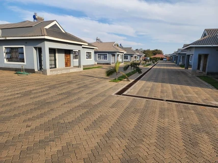 Row of modern cluster homes along a paved private lane